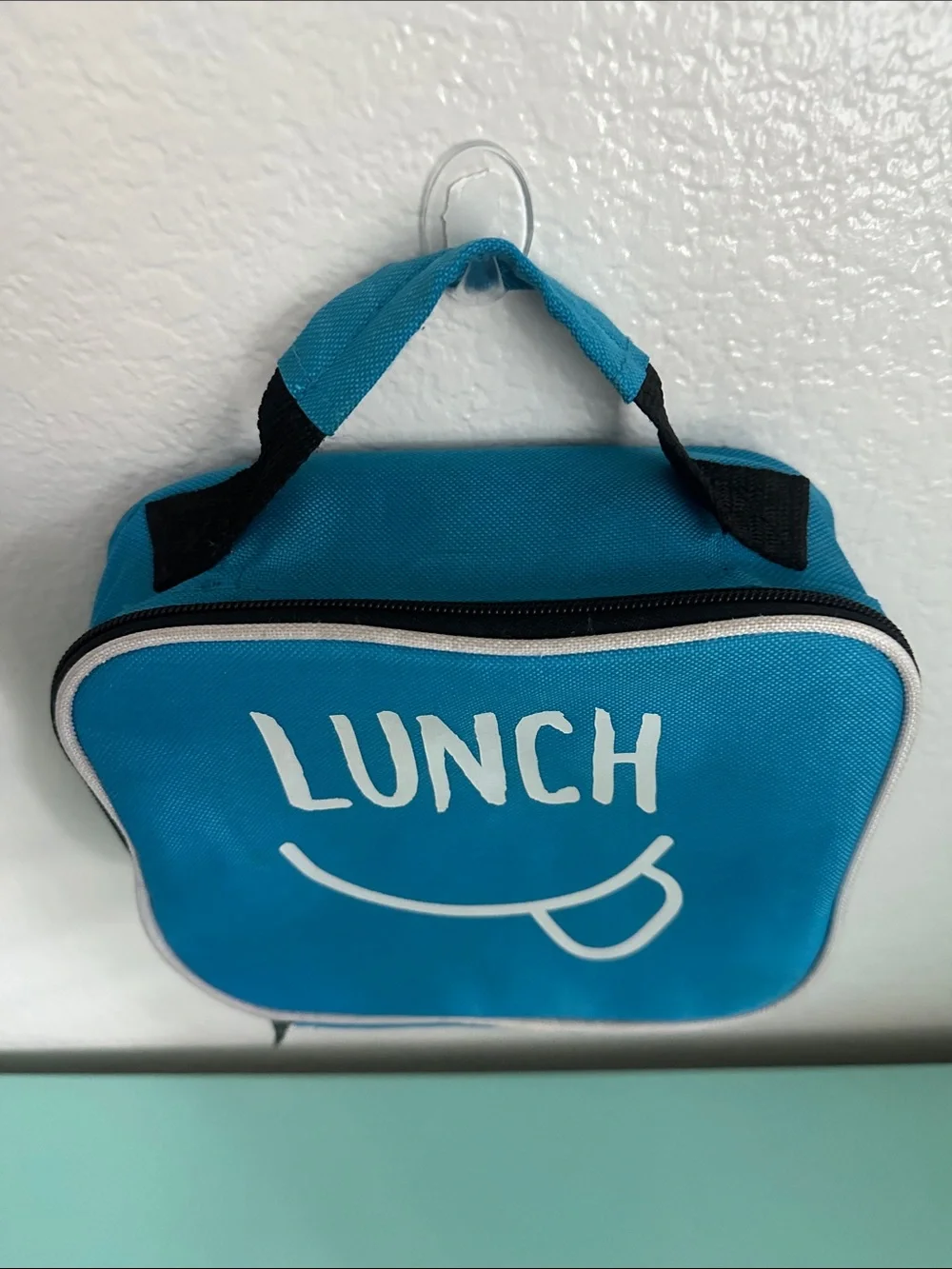Walmart blue insulated lunch box with a minimalist white ’LUNCH’ graphic-used